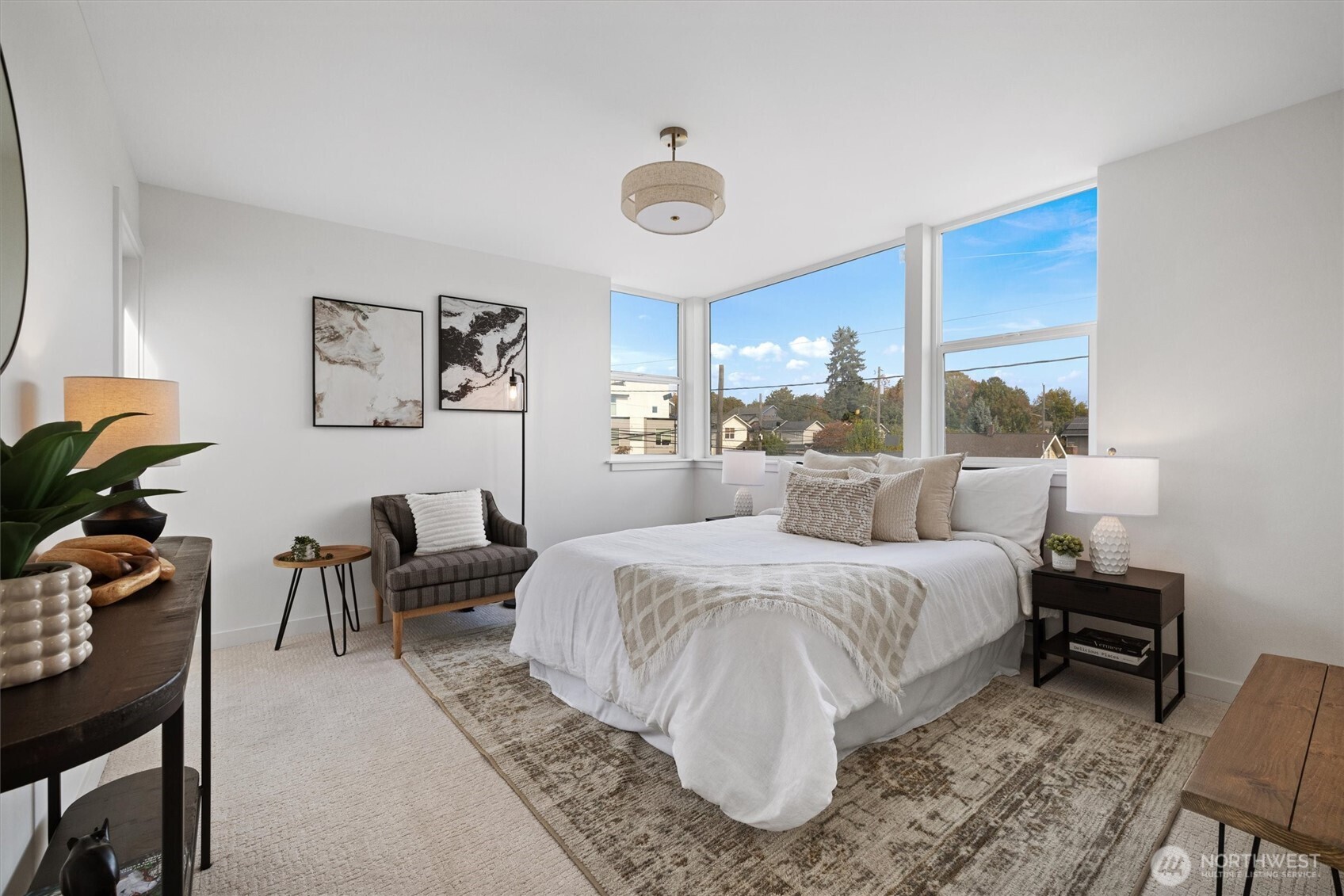 2317 South Judkins Street Seattle, WA 98144 - Photo 10 of 22 a spacious bedroom with a bed a desk and chair with a potted plant