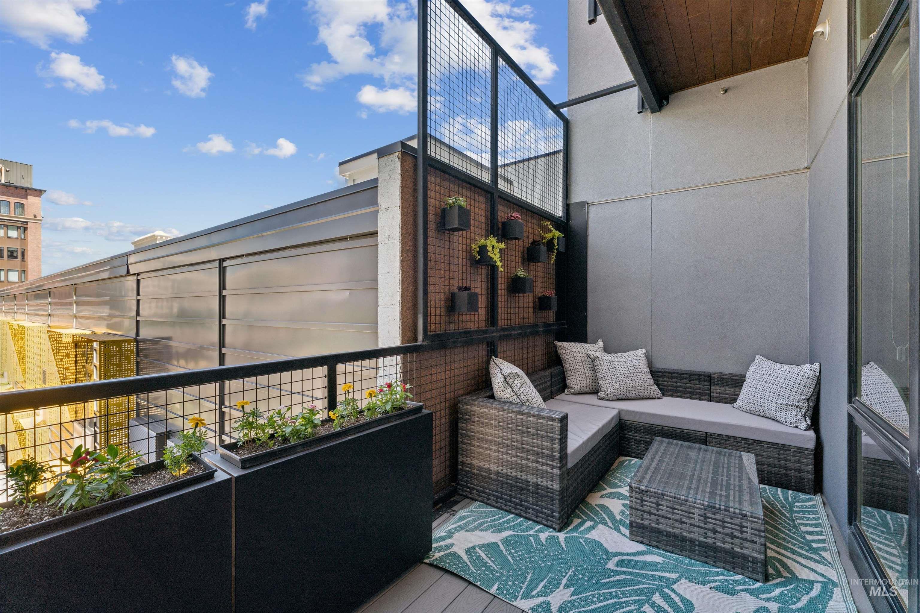 119 South 10th Street, Unit 307 Boise, ID 83702 - Photo 26 of 47 Private outdoor balcony with durable composite decking, metal railing, and built-in planters