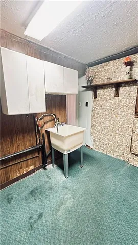 a bedroom with a bed and a table