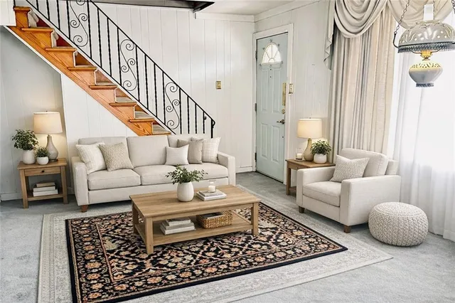 a living room with furniture and a rug