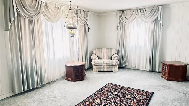 a bedroom with furniture and a window