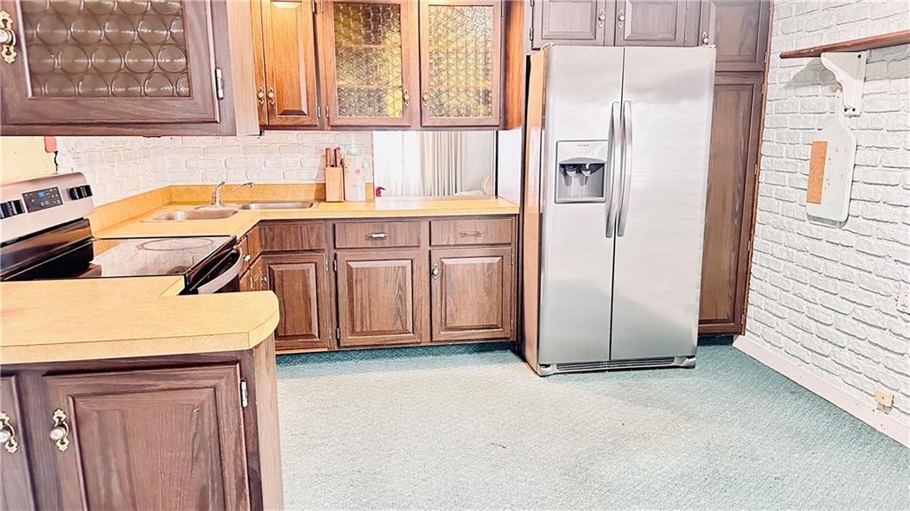 840 Meadow Avenue Monaca, PA 15061 - Photo 6 of 24 a kitchen with a refrigerator sink and cabinets
