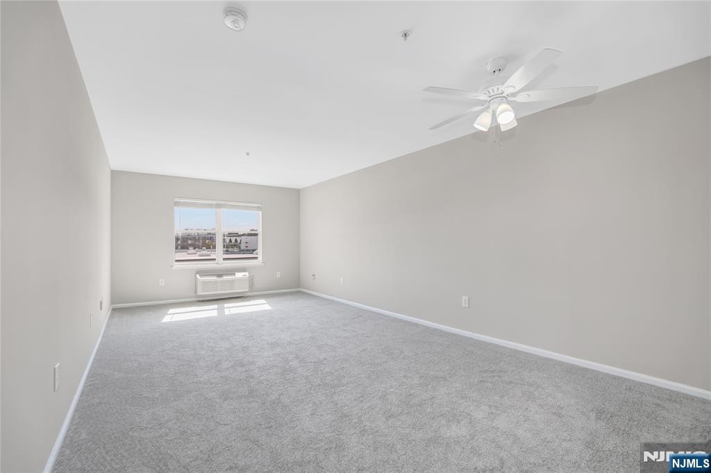 905 River Road, Unit 312 Edgewater, NJ 07020 - Photo 4 of 33 an empty room with a view of a room