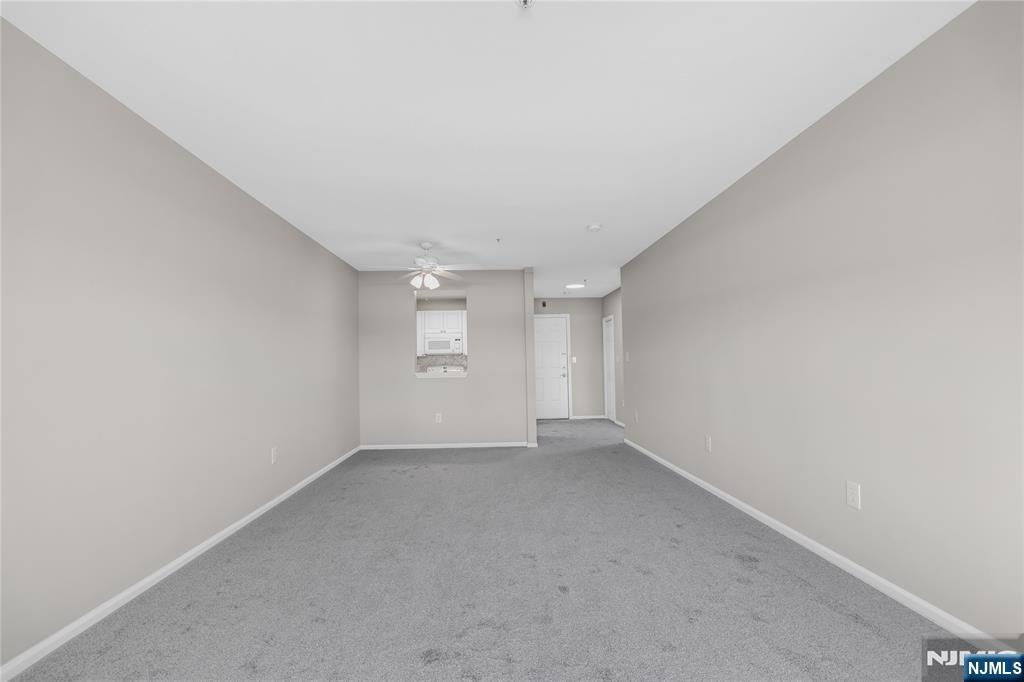 905 River Road, Unit 312 Edgewater, NJ 07020 - Photo 7 of 33 a view of an empty room with a window