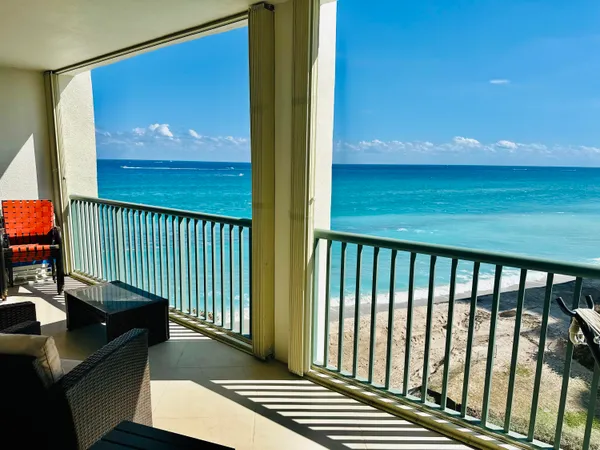 a view of a balcony with furniture