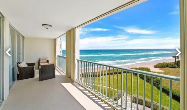 a balcony with view of ocean view