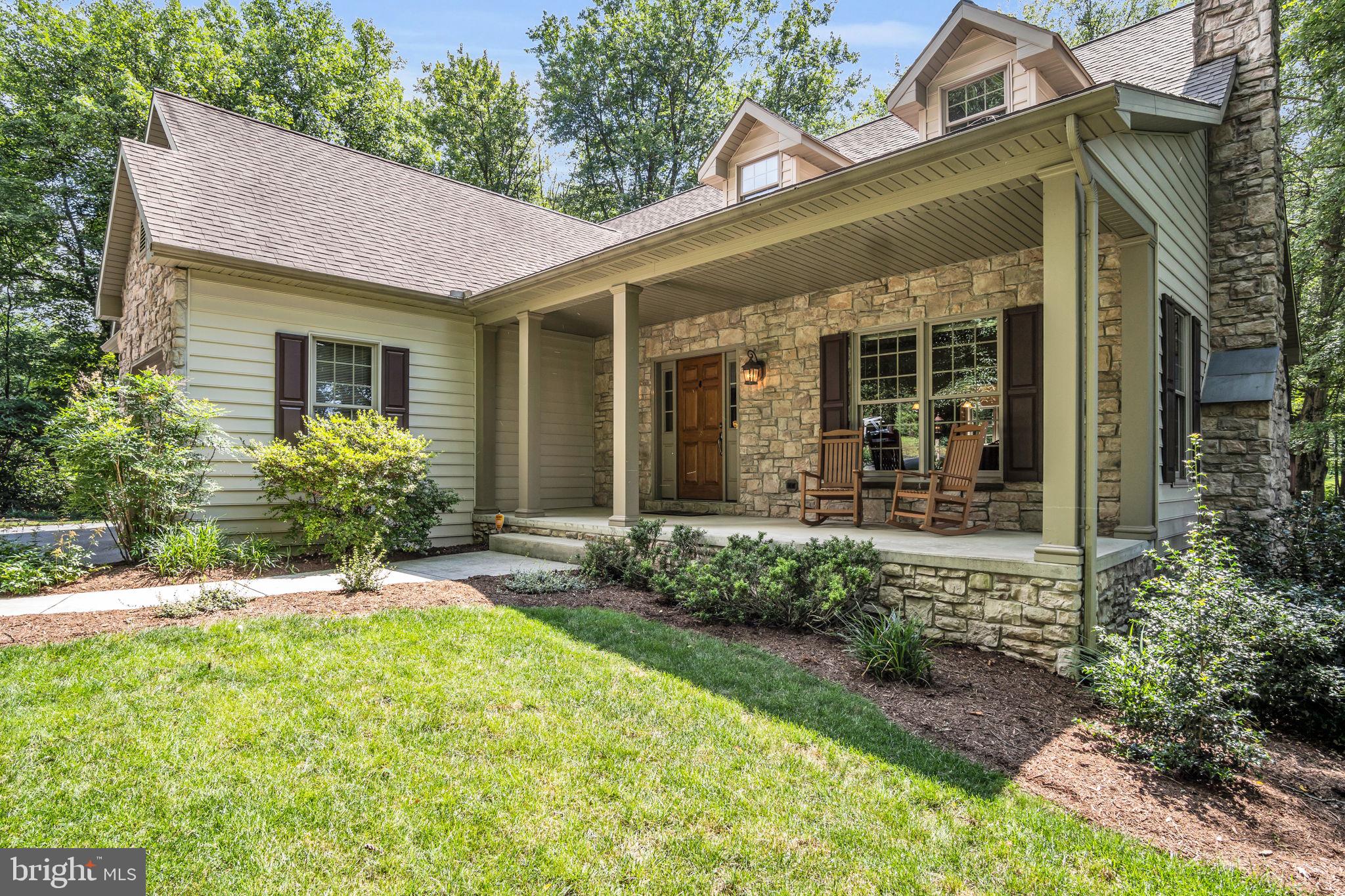 362 Aberdeen Road Elizabethtown, PA 17022 - Photo 46 of 67 front view of a house with potted plants and a bench