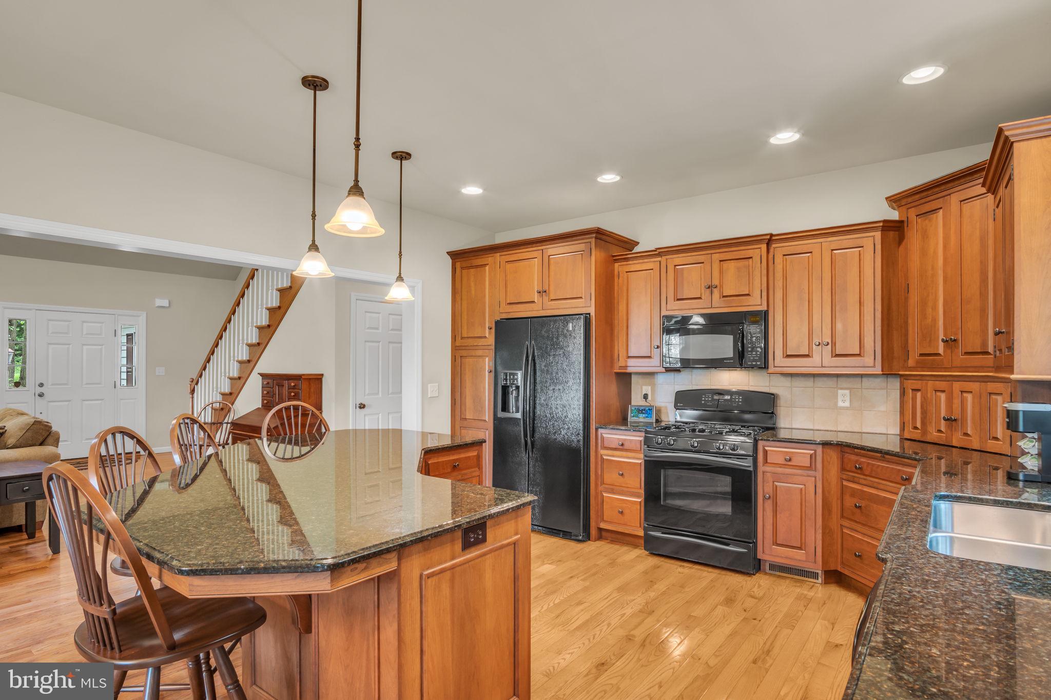 362 Aberdeen Road Elizabethtown, PA 17022 - Photo 7 of 67 a kitchen with stainless steel appliances granite countertop a sink refrigerator and cabinets