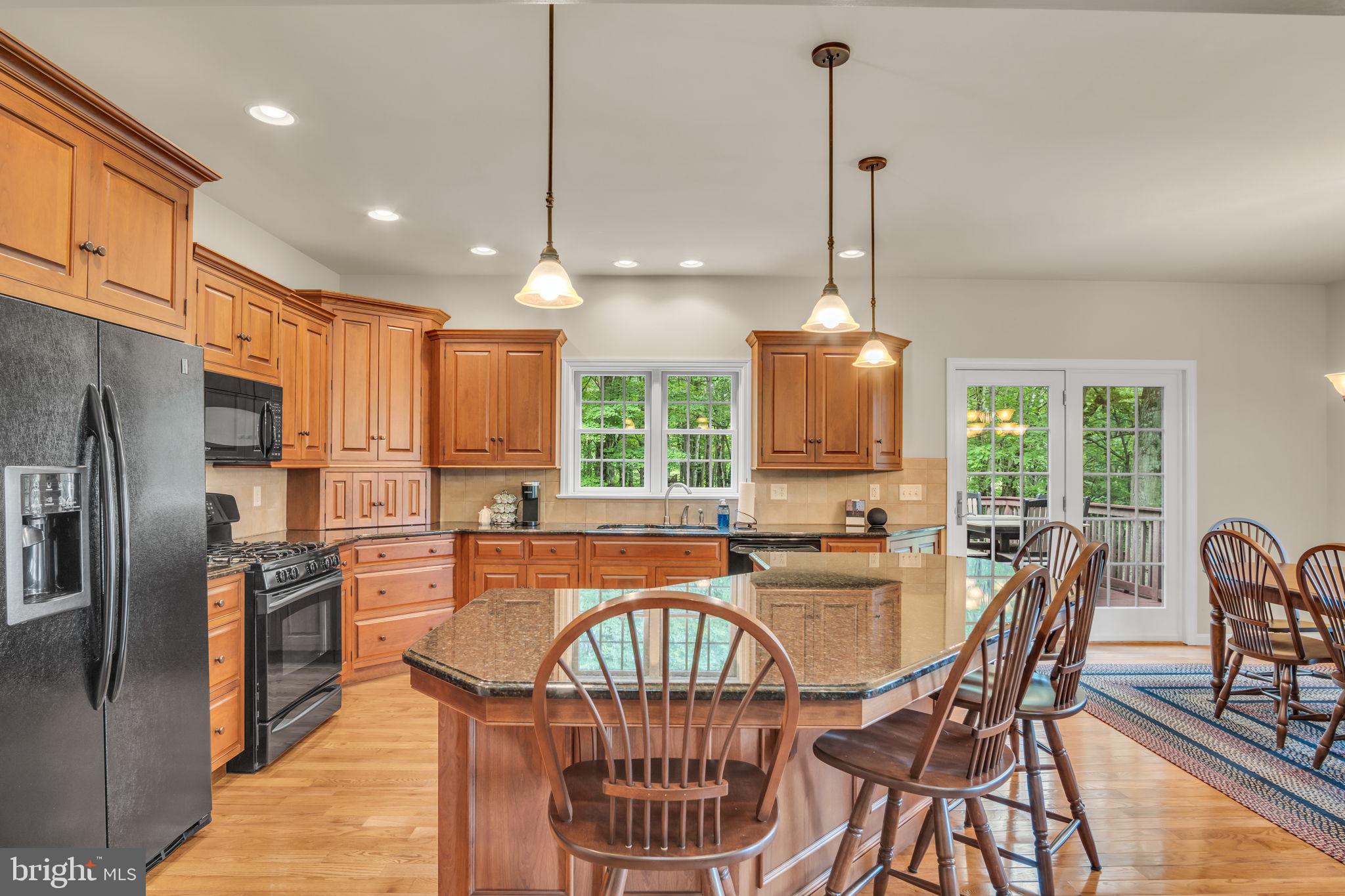 362 Aberdeen Road Elizabethtown, PA 17022 - Photo 10 of 67 a dining room with furniture a chandelier and wooden floor