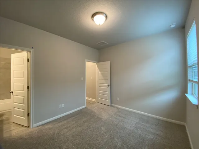 a view of an empty walk in closet