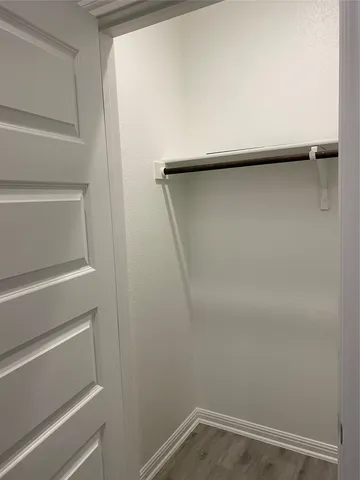 a bathroom with a shower a sink and a mirror