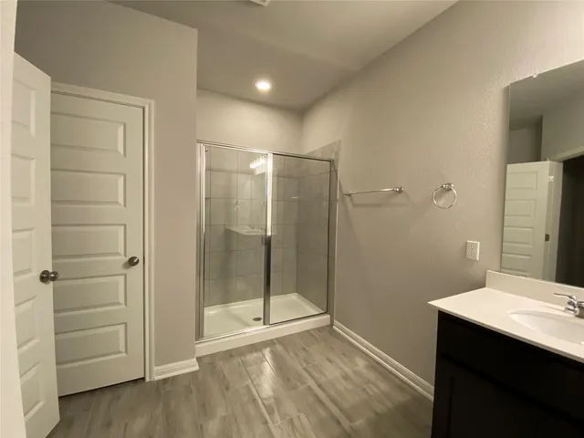 a bathroom with a sink double vanity and a mirror