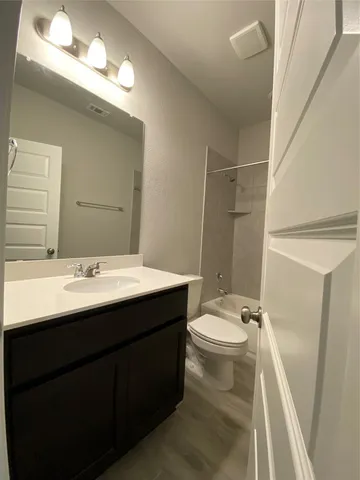 an empty room with windows and entrance