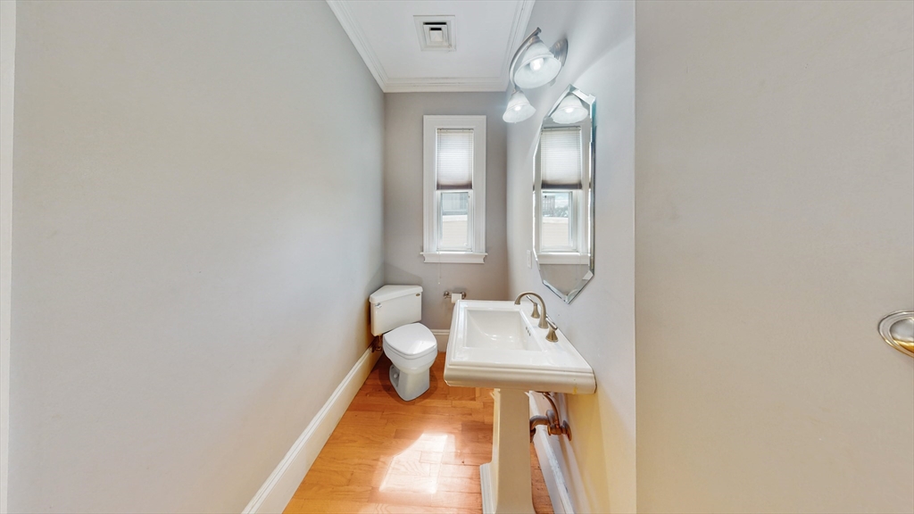 30-32 Ward Street, Unit 2 Boston, MA 02127 - Photo 12 of 14 a bathroom with a sink and a mirror