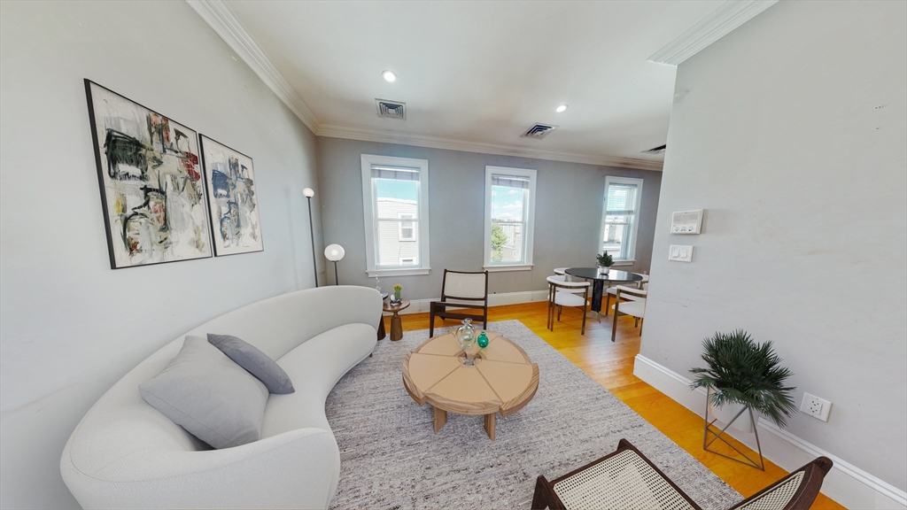 30-32 Ward Street, Unit 2 Boston, MA 02127 - Photo 3 of 14 a living room with furniture and a large window