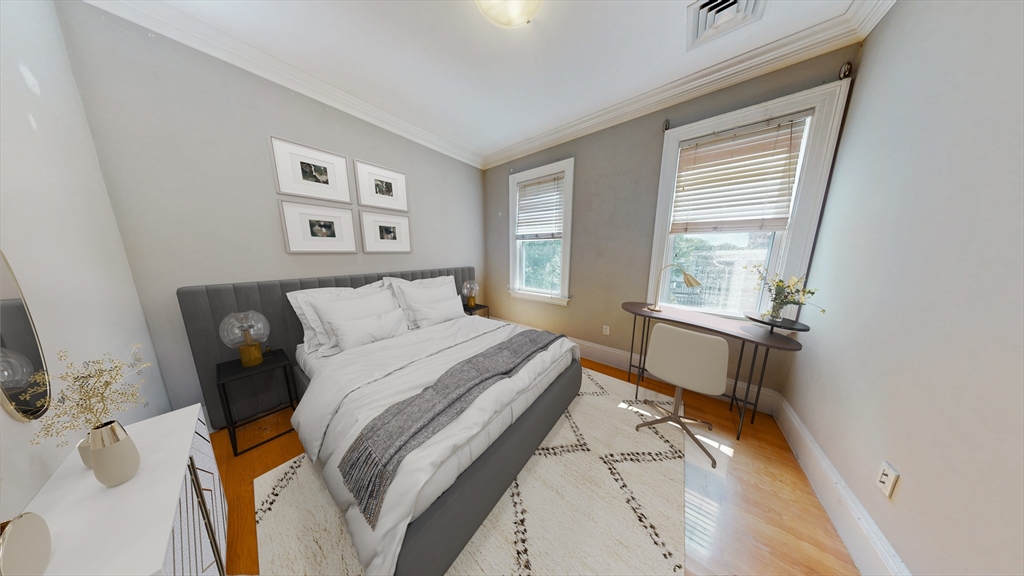 30-32 Ward Street, Unit 2 Boston, MA 02127 - Photo 10 of 14 a bedroom with a bed and a window