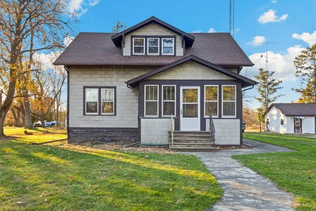 a front view of a house with a yard