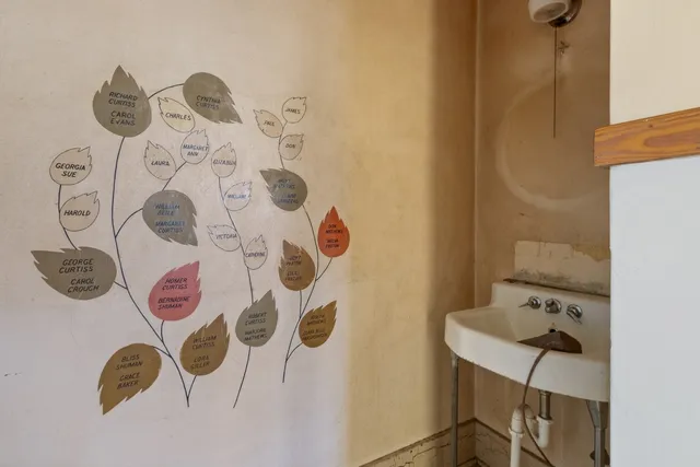 a bathroom with a sink and mirror with shower