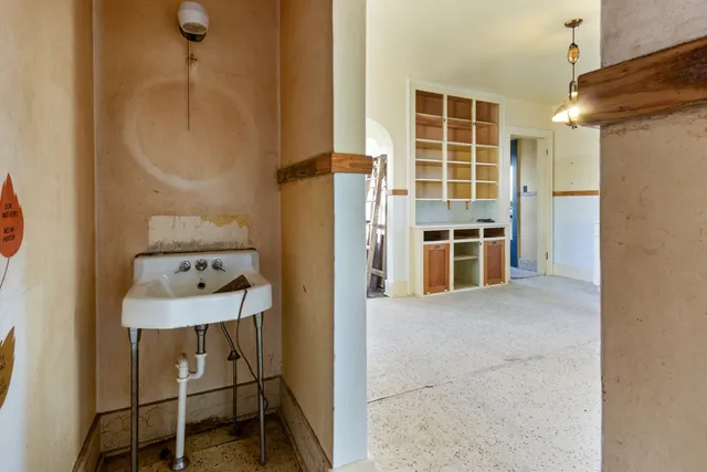 a view of kitchen with furniture and windows