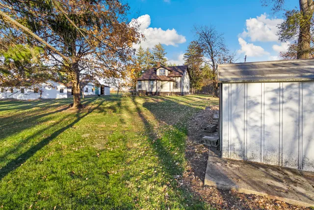 a view of yard with large trees