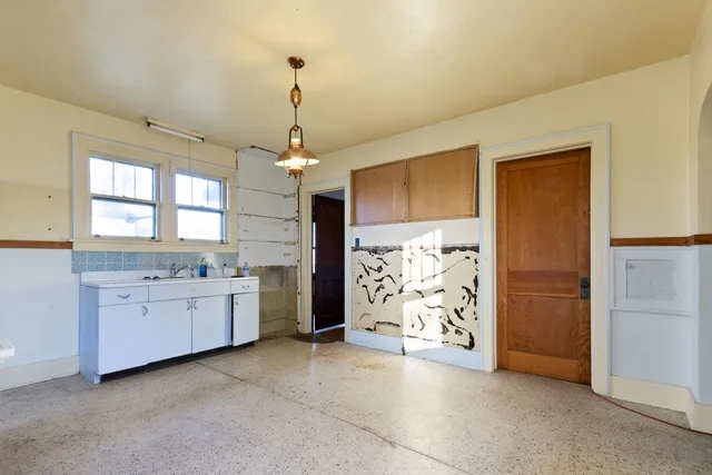 a large bathroom with a granite countertop sink a bathtub and shower