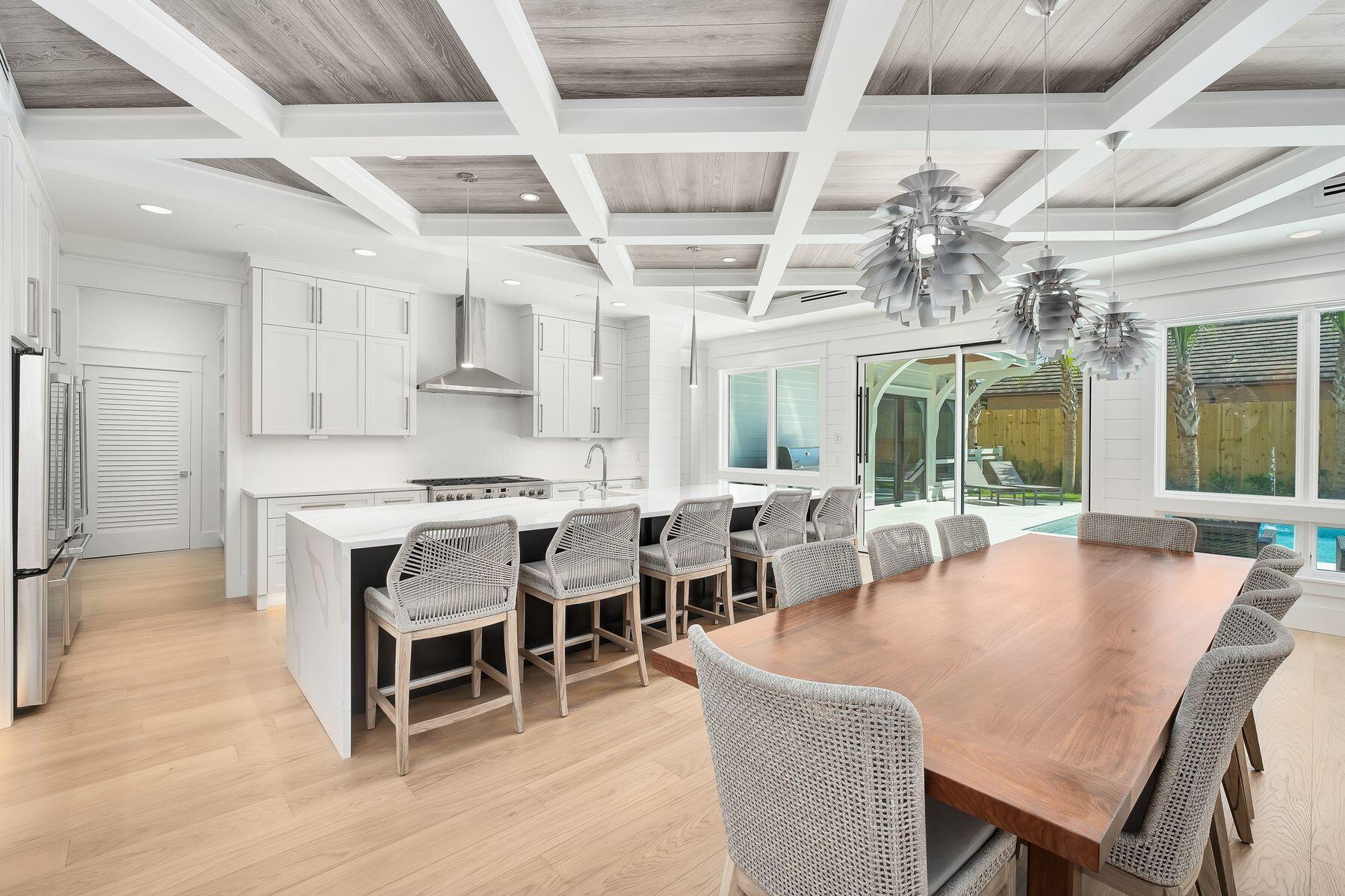 56 Pelican Glide Lane Seacrest, FL 32461 - Photo 11 of 55 a large kitchen with a table and chairs