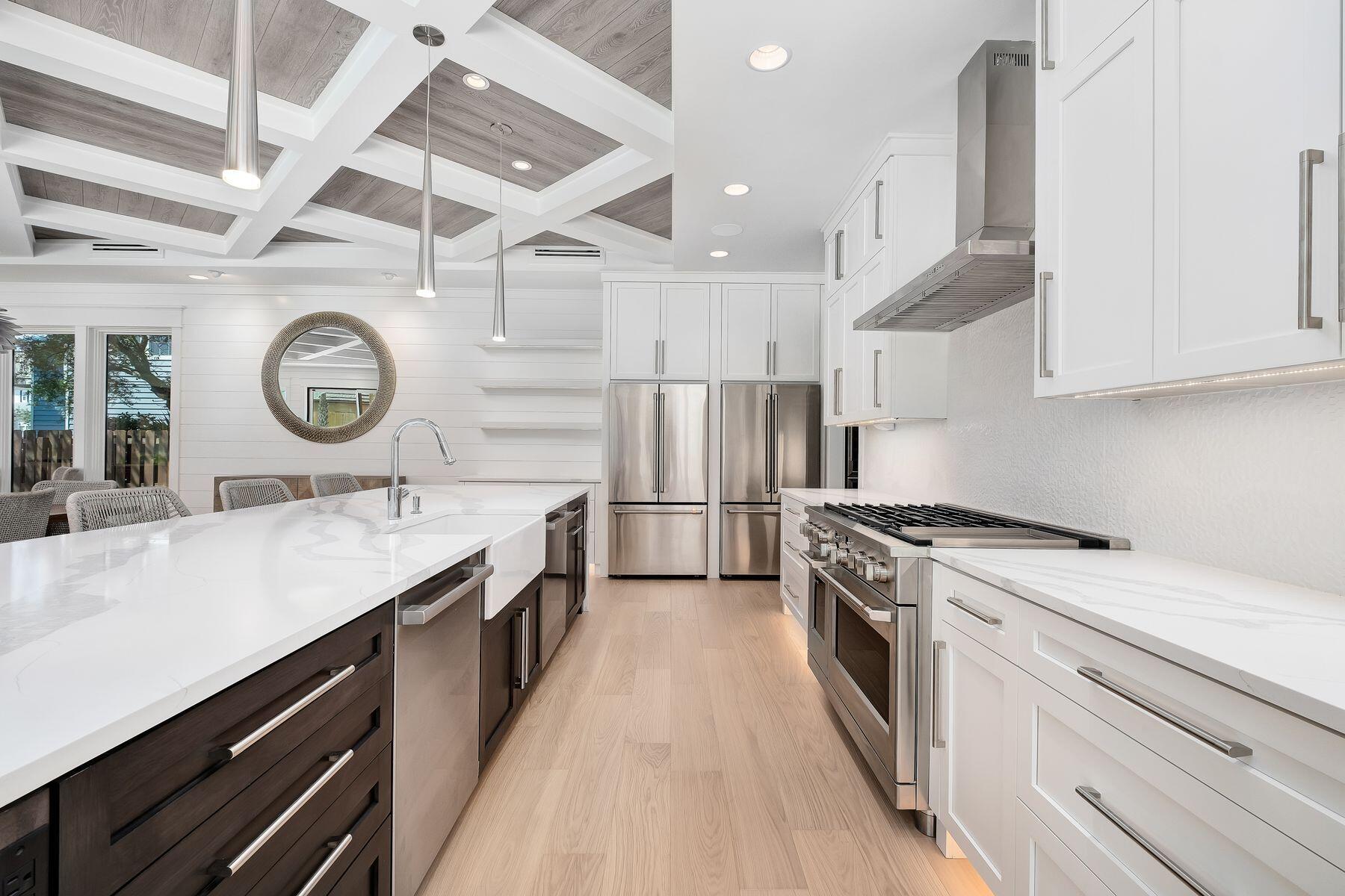 56 Pelican Glide Lane Seacrest, FL 32461 - Photo 14 of 55 a kitchen with a stove and a clock