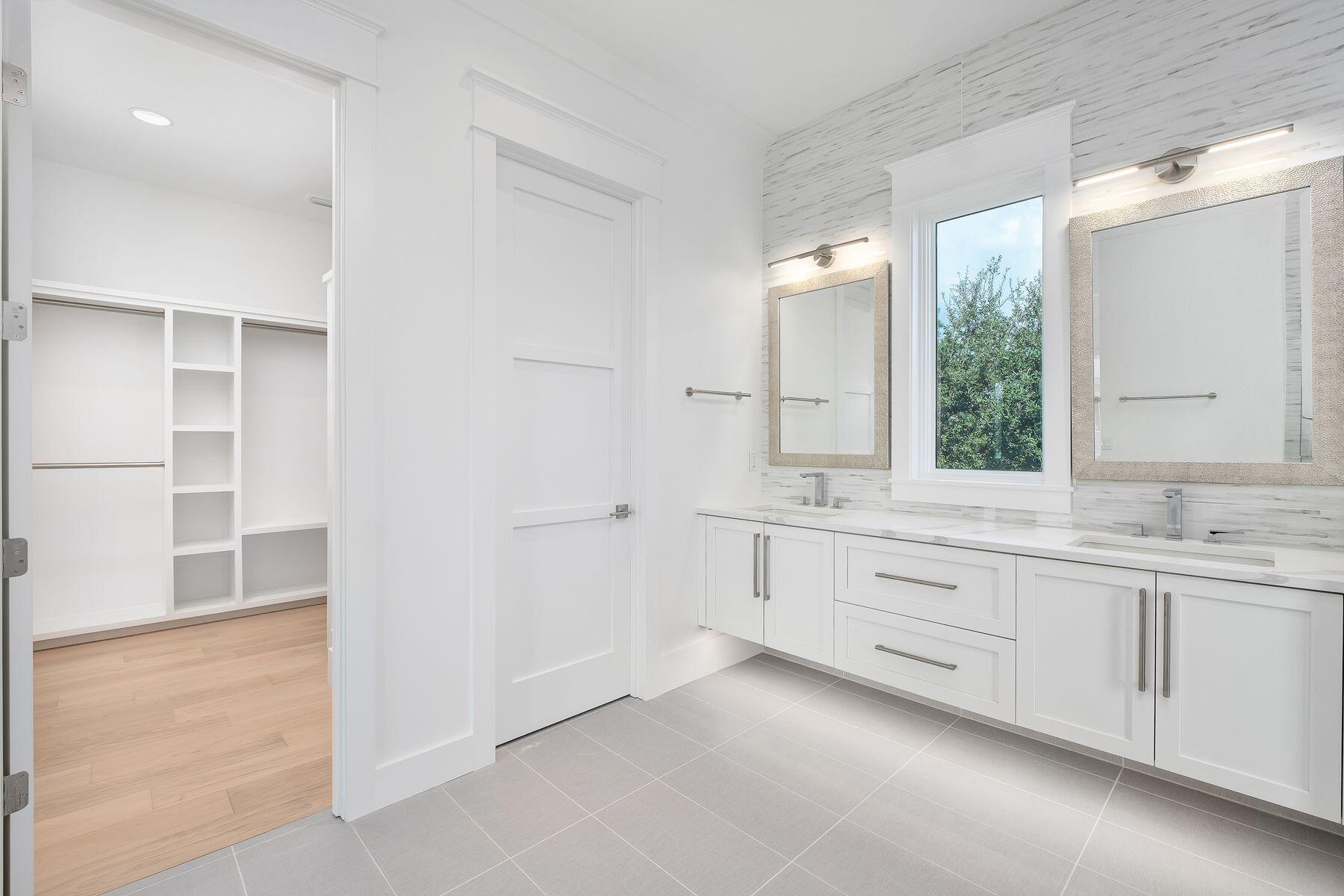 56 Pelican Glide Lane Seacrest, FL 32461 - Photo 26 of 55 a bathroom with a granite countertop sink and a mirror