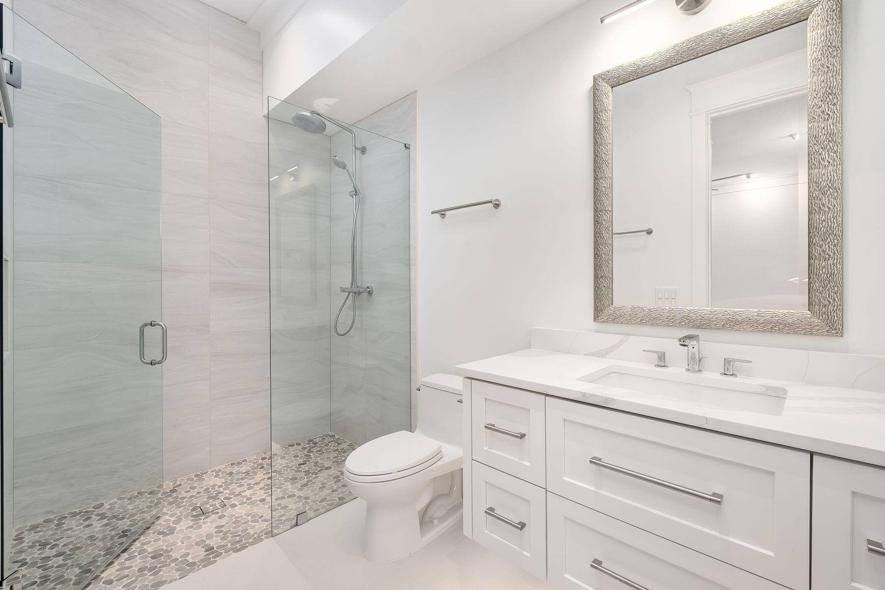 56 Pelican Glide Lane Seacrest, FL 32461 - Photo 30 of 55 a bathroom with a sink a toilet and shower