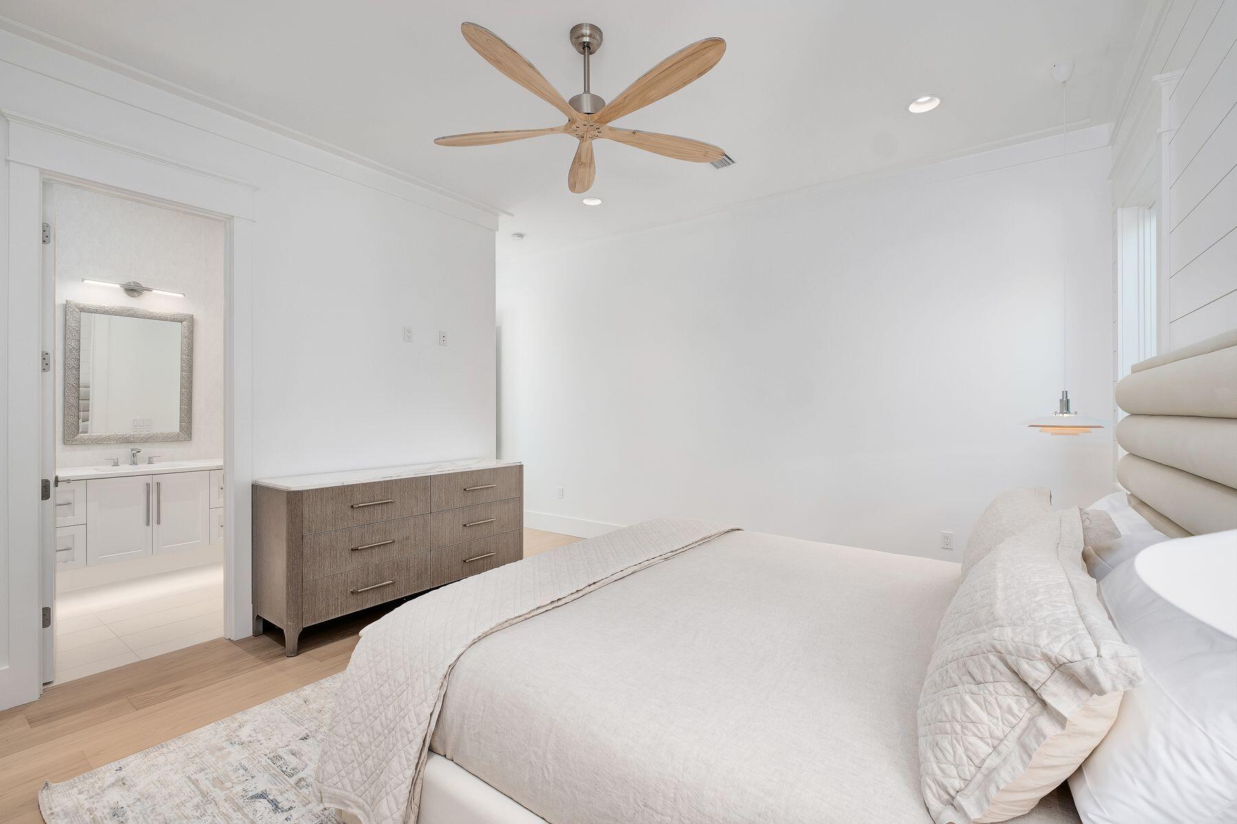 56 Pelican Glide Lane Seacrest, FL 32461 - Photo 32 of 55 a bedroom with a bed and a dresser