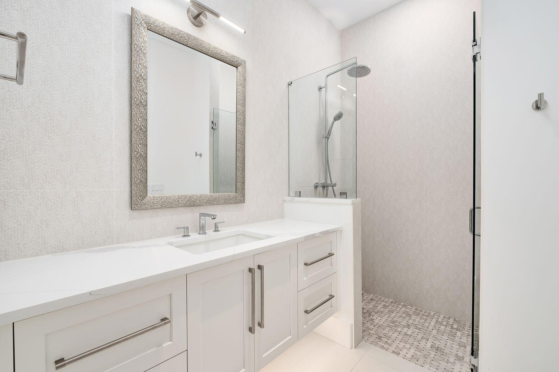 56 Pelican Glide Lane Seacrest, FL 32461 - Photo 33 of 55 a bathroom with a sink and a mirror