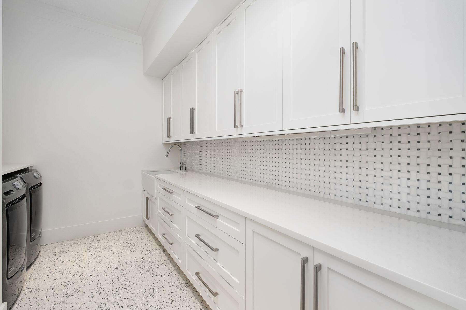 56 Pelican Glide Lane Seacrest, FL 32461 - Photo 39 of 55 a kitchen with white cabinets and a stove