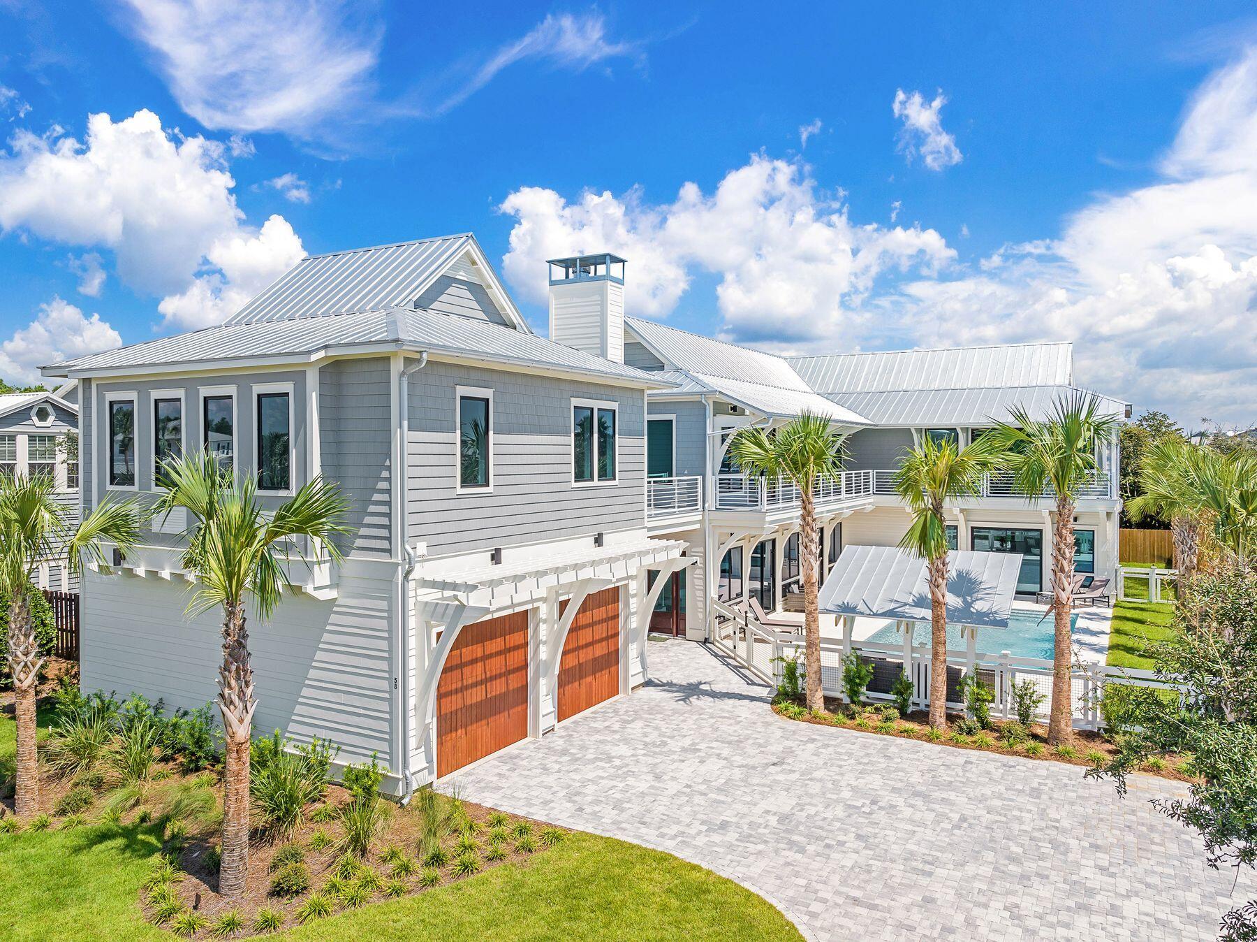 56 Pelican Glide Lane Seacrest, FL 32461 - Photo 41 of 55 a view of a house with a porch and furniture