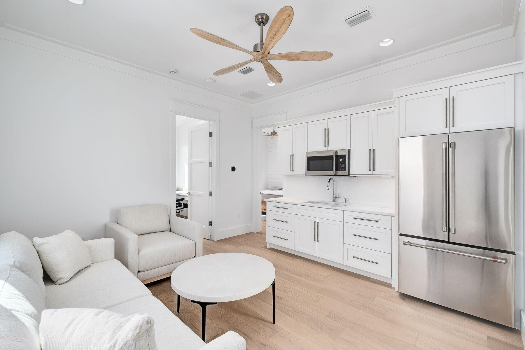 56 Pelican Glide Lane Seacrest, FL 32461 - Photo 42 of 55 a kitchen with stainless steel appliances a refrigerator sink and microwave