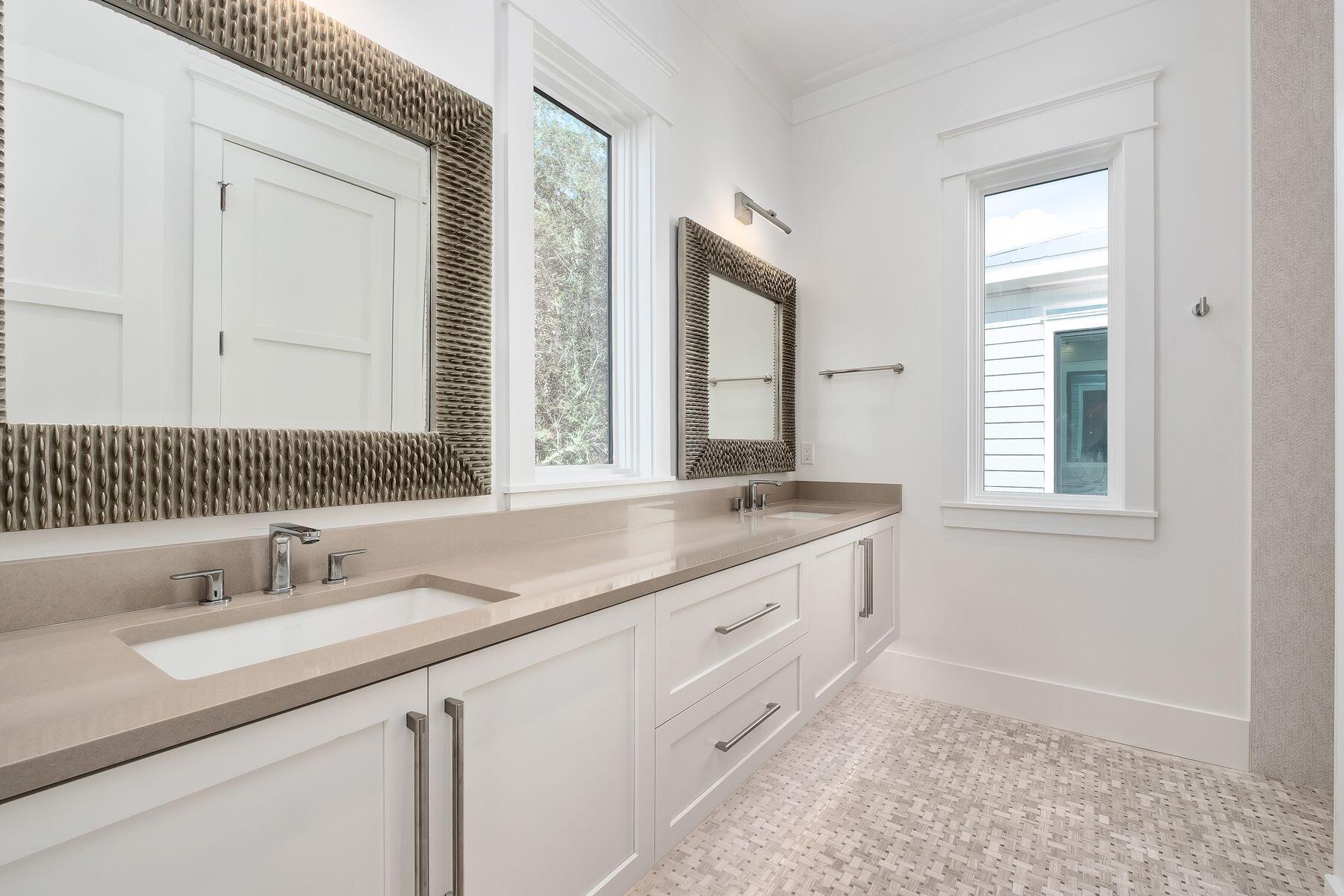 56 Pelican Glide Lane Seacrest, FL 32461 - Photo 45 of 55 a bathroom with a granite countertop sink and a mirror