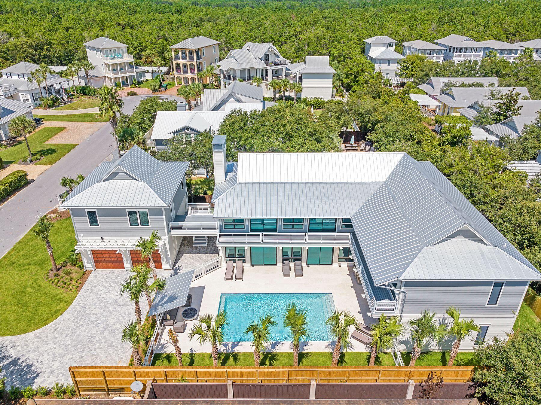 56 Pelican Glide Lane Seacrest, FL 32461 - Photo 5 of 55 an aerial view of multiple houses with a yard