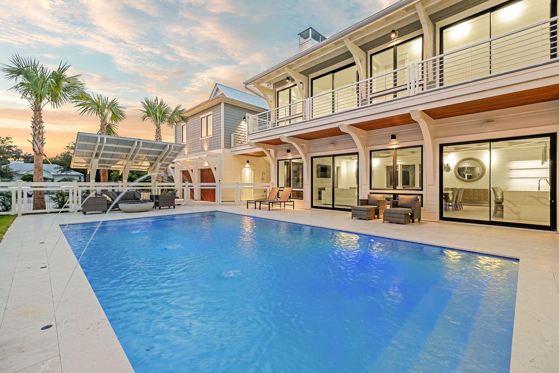 56 Pelican Glide Lane Seacrest, FL 32461 - Photo 51 of 55 a view of a swimming pool with an outdoor seating