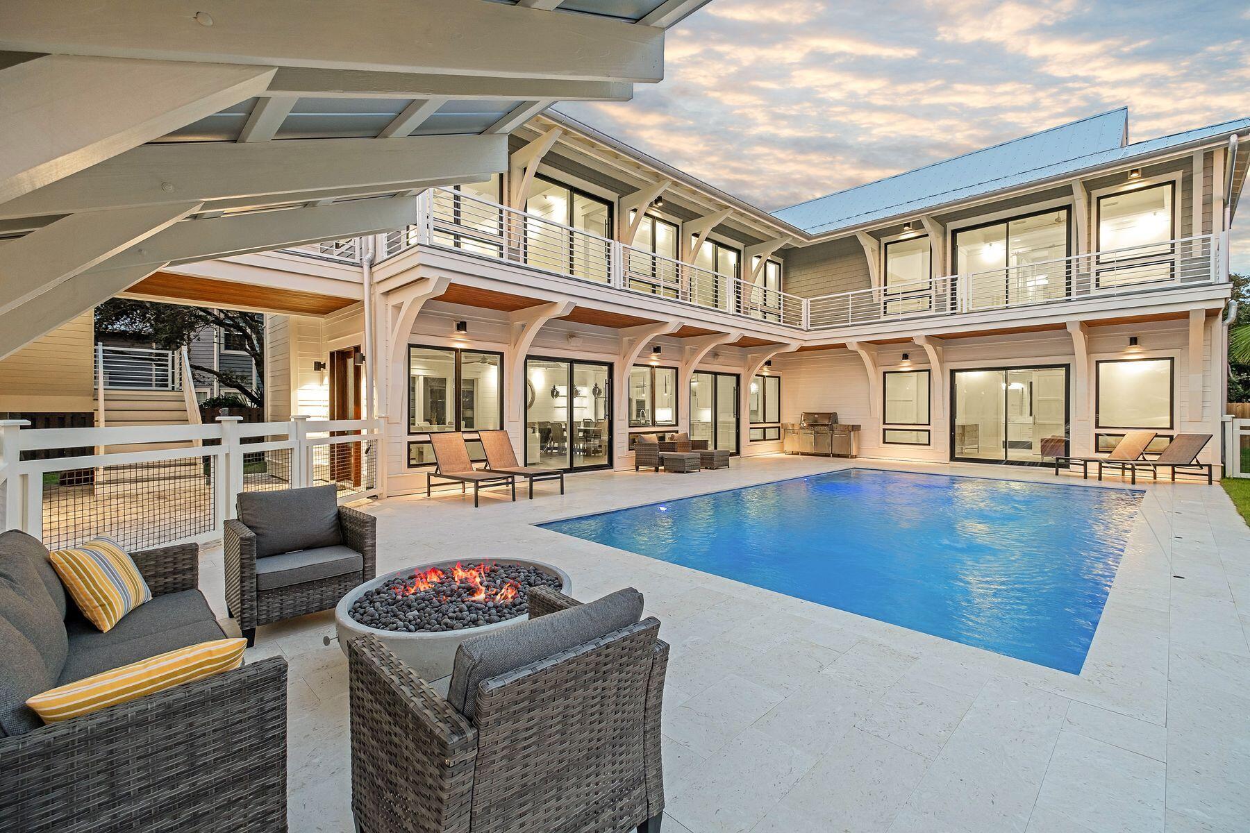 56 Pelican Glide Lane Seacrest, FL 32461 - Photo 52 of 55 a view of a patio with couches chairs and potted plants with sky view