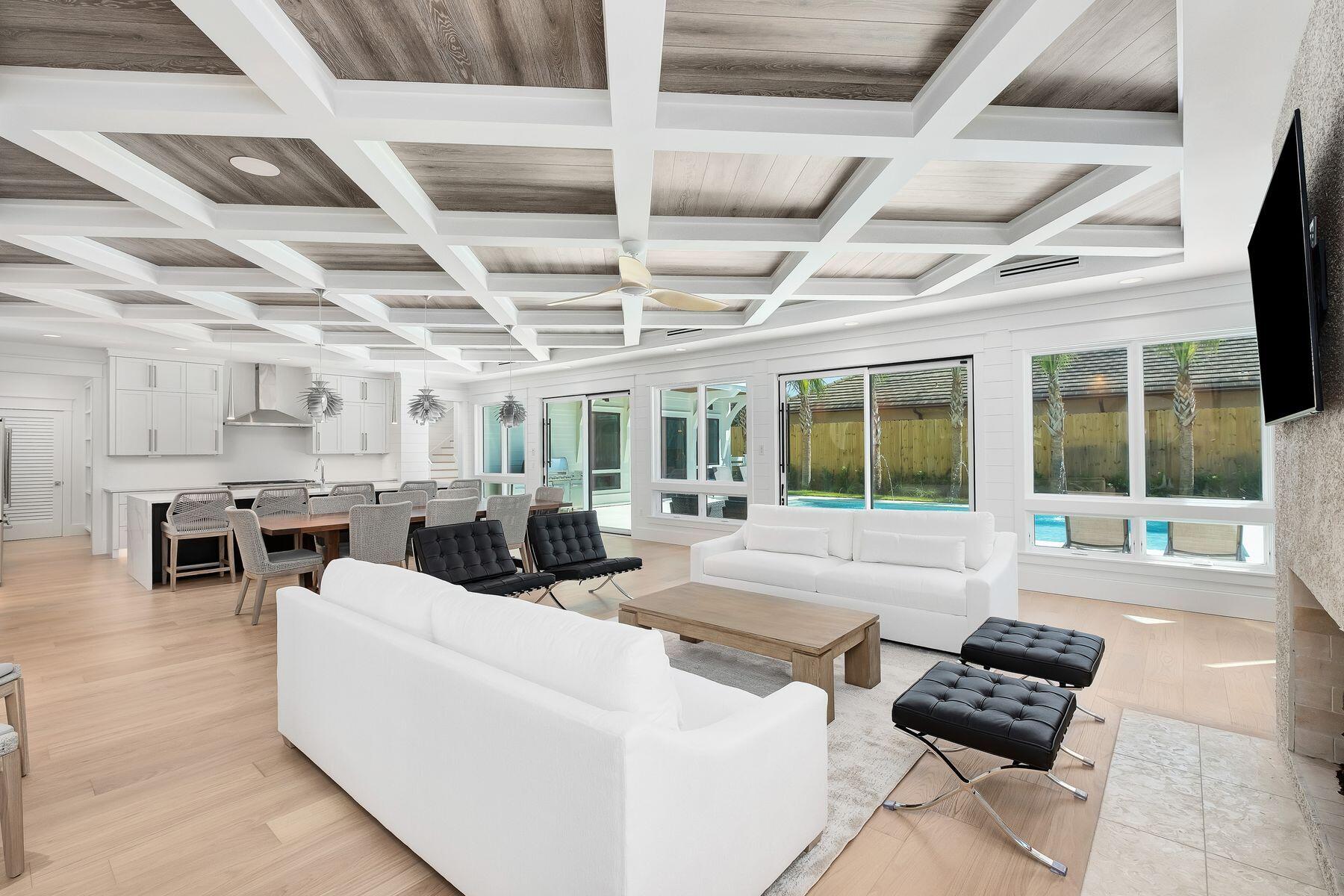 56 Pelican Glide Lane Seacrest, FL 32461 - Photo 6 of 55 a living room with furniture and a flat screen tv