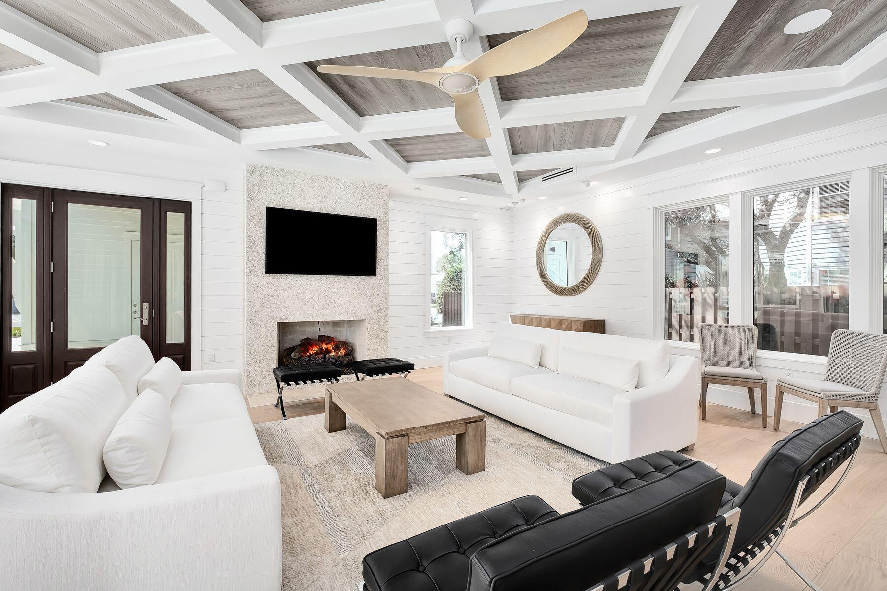 56 Pelican Glide Lane Seacrest, FL 32461 - Photo 8 of 55 a living room with furniture a large window and a clock