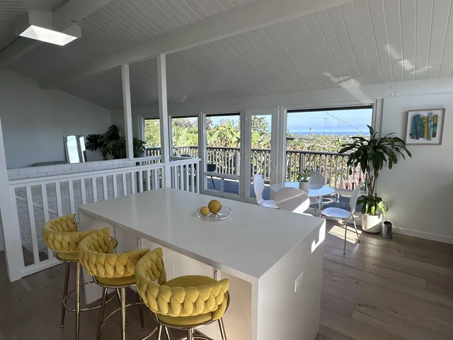 a view of a dining room with furniture wooden floor and chandelier