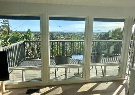 a view of a balcony and floor to ceiling window
