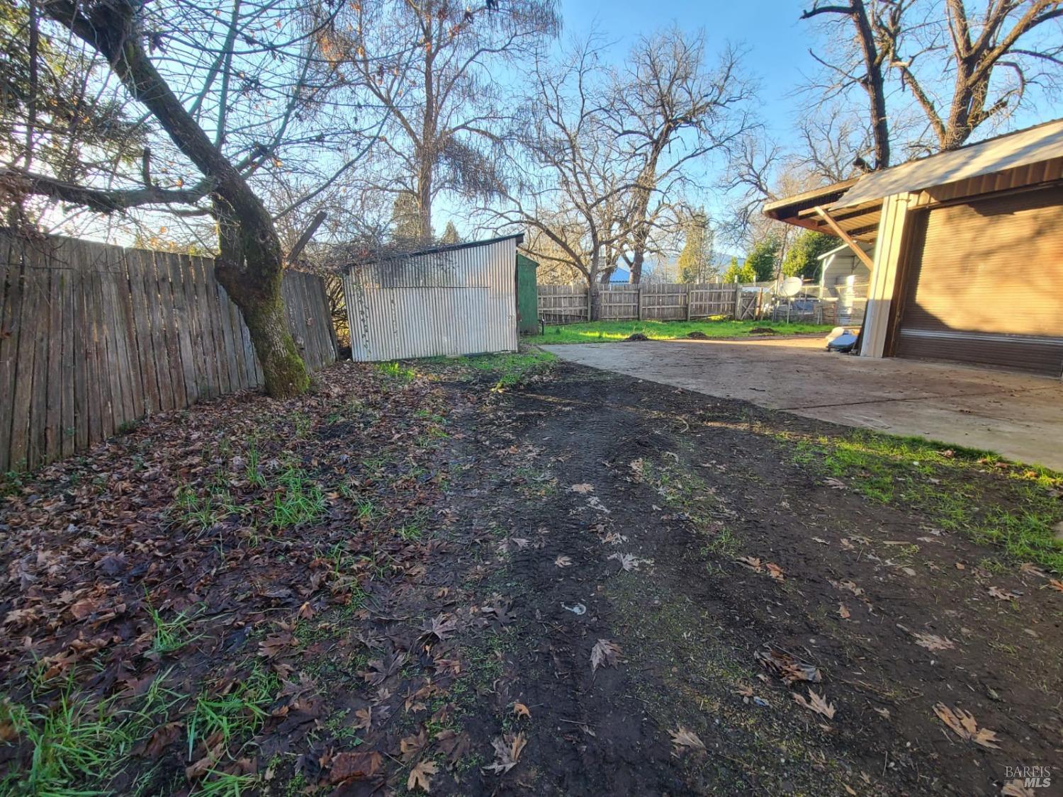 76440 Covelo Road Covelo, CA 95428 - Photo 17 of 19 a view of backyard with tree and wooden fence