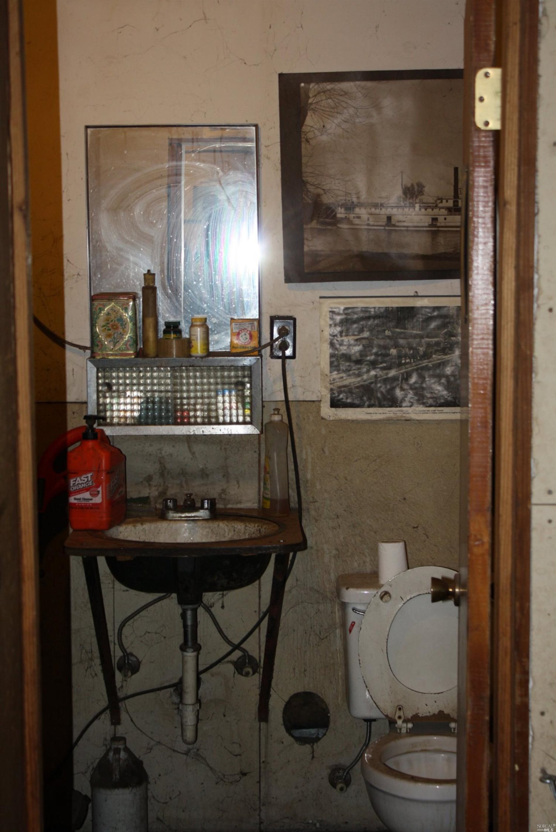 76440 Covelo Road Covelo, CA 95428 - Photo 5 of 19 a bathroom with a toilet a sink and mirror