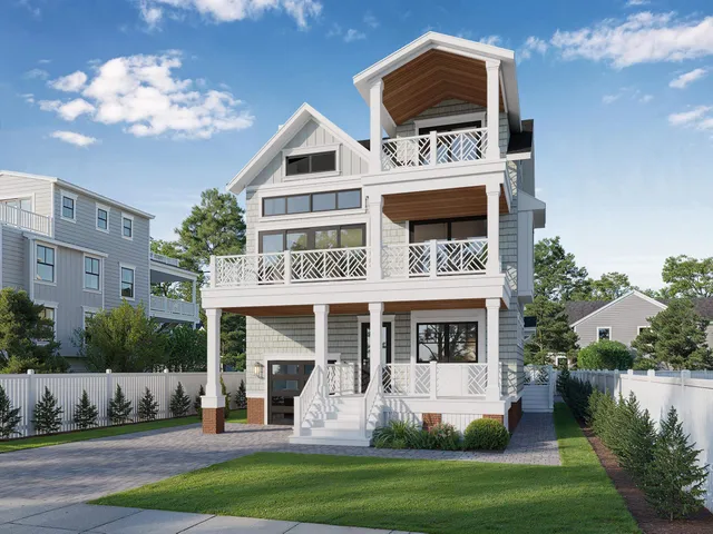 a front view of a house with a yard table and chairs