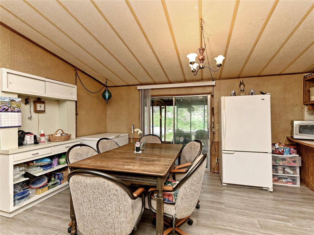 148 River Road Liberty Hill, TX 78642 - Photo 14 of 22 a view of a dining room with furniture window and wooden floor