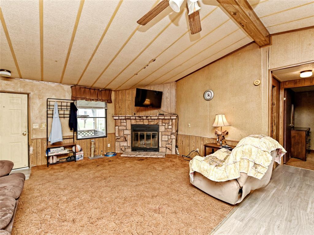 148 River Road Liberty Hill, TX 78642 - Photo 8 of 22 a living room with furniture and a fireplace