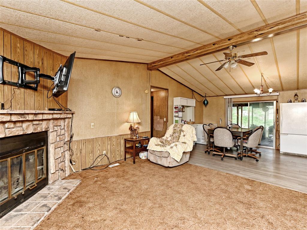 148 River Road Liberty Hill, TX 78642 - Photo 9 of 22 a living room with furniture oven and a fireplace