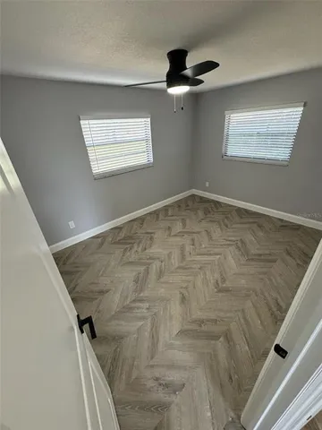 a view of empty room with windows