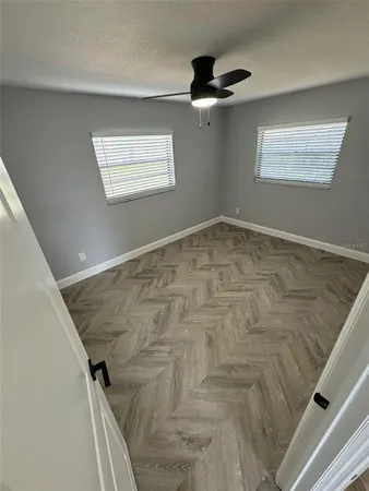 a view of empty room with windows